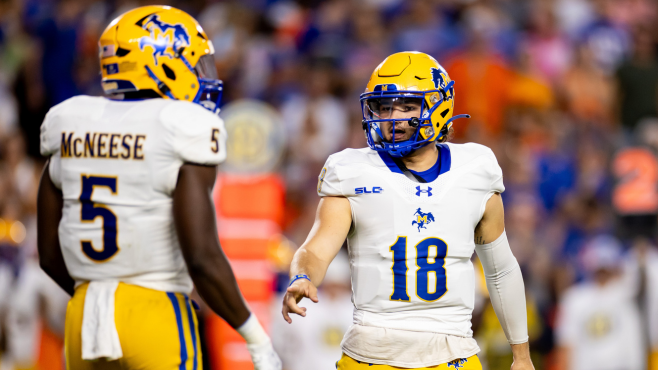 McNeese quarterback Nate Glantz (18) talks with running back D'angelo Durham (5) during a game against  the Florida Gators at Ben Hill Griffin Stadium earlier this season. -- Photo by Matt Pendleton-USA TODAY Sports / Reuters