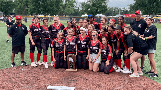 The Port Barre Red Devils pose with the Class 2A state runner-up trophy on Field 16 at Frasch Park on Saturday. -- Photo by Raymond Partsch III