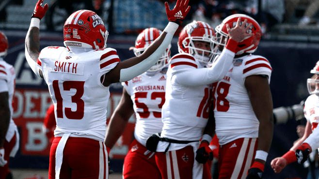 Louisiana Ragin' Cajuns running back Chris Smith (13) reacts after a touchdown during the first half against the Houston Cougars in the 2022 Independence Bowl at Independence Stadium. --0 Photo by Petre Thomas-USA TODAY Sports/Reuters